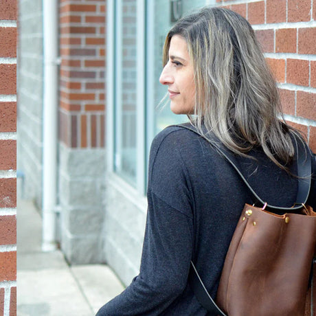 Julie Simon demonstrates how to create functional leather projects like this convertible leather backpack.